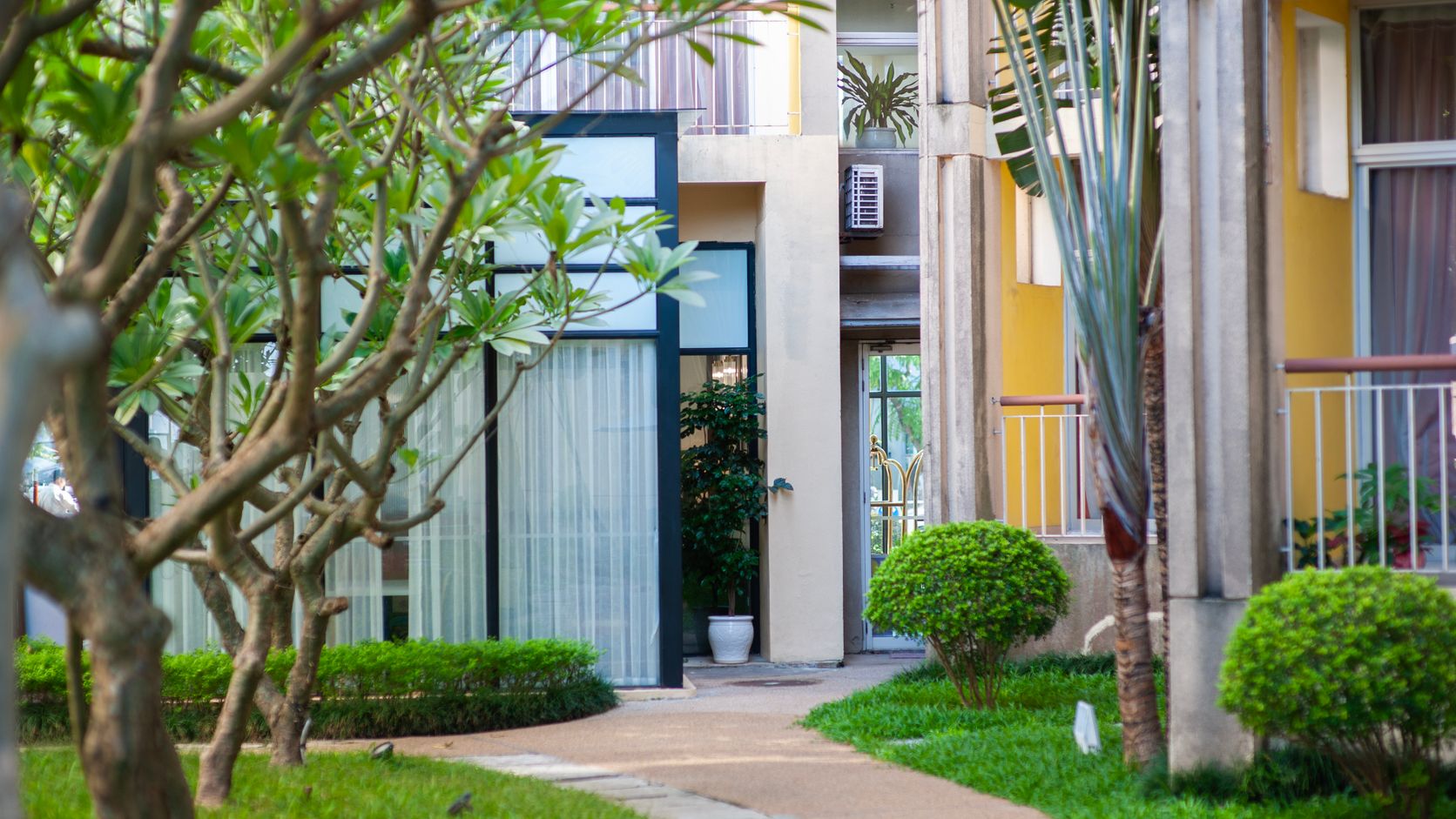Apartment courtyard with a green walkway